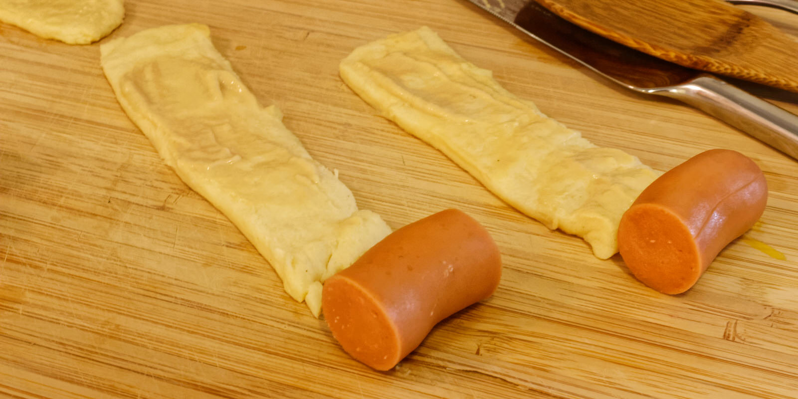 Sausage cut the same size as the width of the dough stripe Sausage cut the same size as the width of the dough stripe